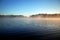 Surface texture of a forest lake. Background, surface water. Lake covered in mist