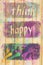 Surface of  wooden background  with positive quote think happy