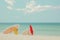 Surfboard on sand tropical beach with seascape calm sea and sky
