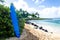 Surfboard on the sandy beach in Hawaii