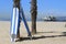 Surfboards against palm tree in front of Santa Monica peer