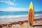 Surfboards on the beach with palm trees and blue sky.