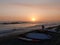 Surfboards and yellow and red sunset in Lima