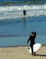 Surfer Adjusts Wetsuit