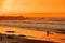 Surfer on beach at Carmel-by-the-Sea