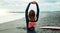 Surfer, beach and woman with stretching, fitness and vacation with getaway trip, workout and training. Person, Japan and