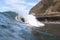 Surfer eating an ice cream with different flavors floating in the sea