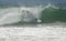 A Surfer falls into a big Wave At Newport Beach In California