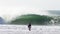 Surfer in Front of a Big Wave