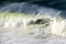 Surfer on Getxo challenge of huge waves