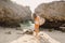 Surfer girl with surfboard going to ocean