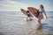 Surfer girl walking with board. Surfer girl. Beautiful young woman at the beach. water sports. Surfing. Summer Vacation. .