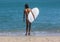 Surfer girl in a white bikini