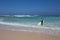 Surfer with golden sand on Corralejo beach Canary islands Spain