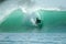 Surfer on green wave, Mentawai Islands, Indonesia