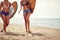 Surfer happy girl walking with board on the sandy beach