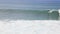 Surfer in high waves on shore of the Portugese island of Madeira