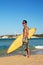 Surfer holding a surfboard