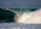 A surfer inside the barrel of a wave