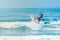 Surfer jumping wave with a board at Sayulita Nayarit Beach