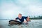 Surfer man floats on surf board, waits a waves