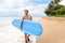 Surfer man going longboard surfing on maui beach