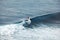 Surfer in ocean. Bali surfing aerial shot