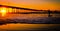 Surfer at the Ocean Beach Pier at Sunset