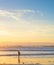 Surfer ocean beach sunset background