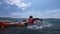 Surfer paddles in the ocean