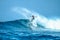 Surfer on perfect blue aquamarine wave, empty line up, perfect for surfing, clean water, Indian Ocean