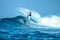 Surfer on perfect blue aquamarine wave, empty line up, perfect for surfing, clean water, Indian Ocean