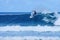 Surfer on perfect blue aquamarine wave, empty line up, perfect for surfing, clean water, Indian Ocean