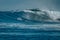Surfer on perfect blue big tube wave, empty line up, perfect for surfing, clean water in Indian Ocean
