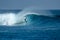 Surfer on perfect blue big tube wave, empty line up, perfect for surfing, clean water in Indian Ocean