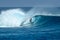 Surfer on perfect blue big tube wave, empty line up, perfect for surfing, clean water in Indian Ocean