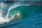 Surfer on perfect blue big tube wave, empty line up, perfect for surfing, clean water, Indian Ocean in Mentawai islands