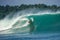 Surfer on perfect blue big tube wave, empty line up, perfect for surfing, clean water, Indian Ocean in Mentawai islands