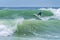 Surfer riding a huge wave during World surf league competition in Lacanau France