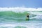 Surfer riding a huge wave during World surf league competition in Lacanau France