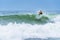 Surfer riding a huge wave during World surf league competition in Lacanau France