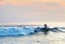 Surfer riding a wave. Bali