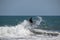 Surfer riding wave at Echo Beach Canggu Bali Indonesia