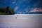 Surfer with sail rushes down the wind on the Columbia River in C