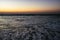 Surfer in the sea at sunset Sidi Kaouki, Morocco