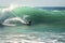 Surfer sliding fast down the tube of a big wave