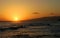 Surfer Surfing during a Hawaiian Sunset