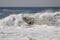 Surfer surfing a large wave at The Wedge in Newport Beach California