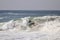 Surfer surfing a large wave at The Wedge in Newport Beach California