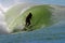 Surfer Surfing a Tubing Wave